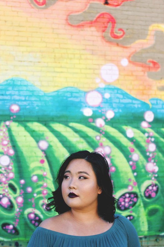 megan looking away from mural